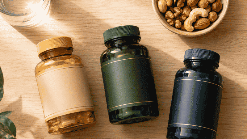 Three supplement bottles representing vitamin D3 K2 and magnesium arranged together showing their synergistic relationship for bone cardiovascular and sleep health