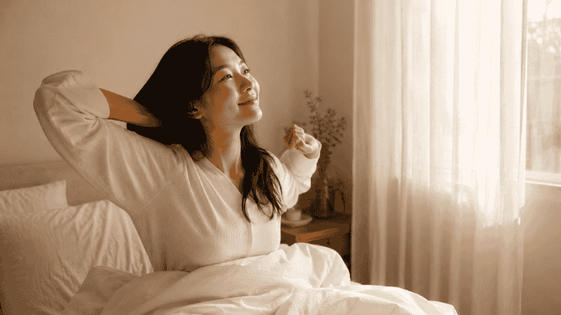 Person waking up refreshed after improved sleep quality with magnesium glycinate support