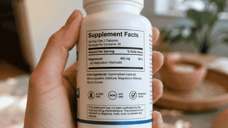 Close-up of magnesium glycinate supplement label showing elemental magnesium content
